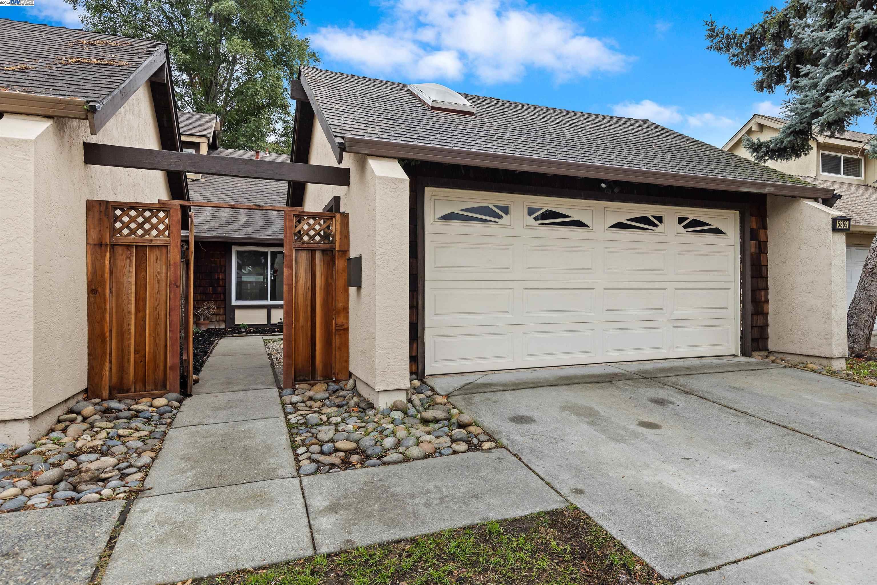 a front view of a house with a garage