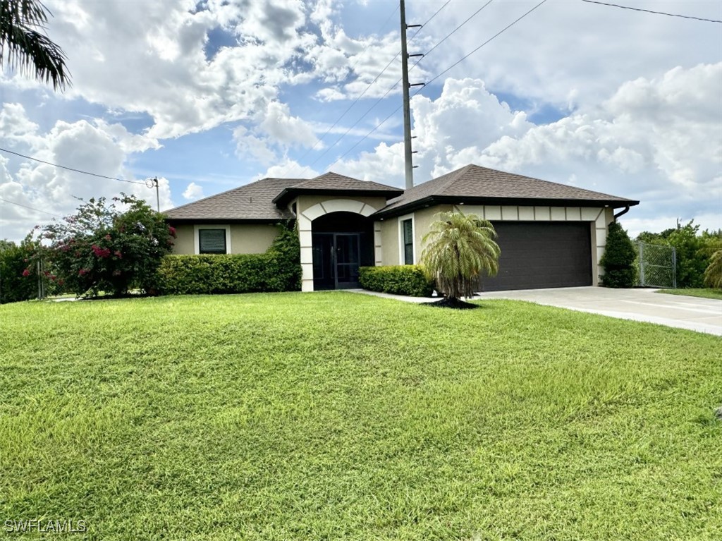 a front view of a house with garden