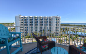 a roof deck with outdoor seating and city view