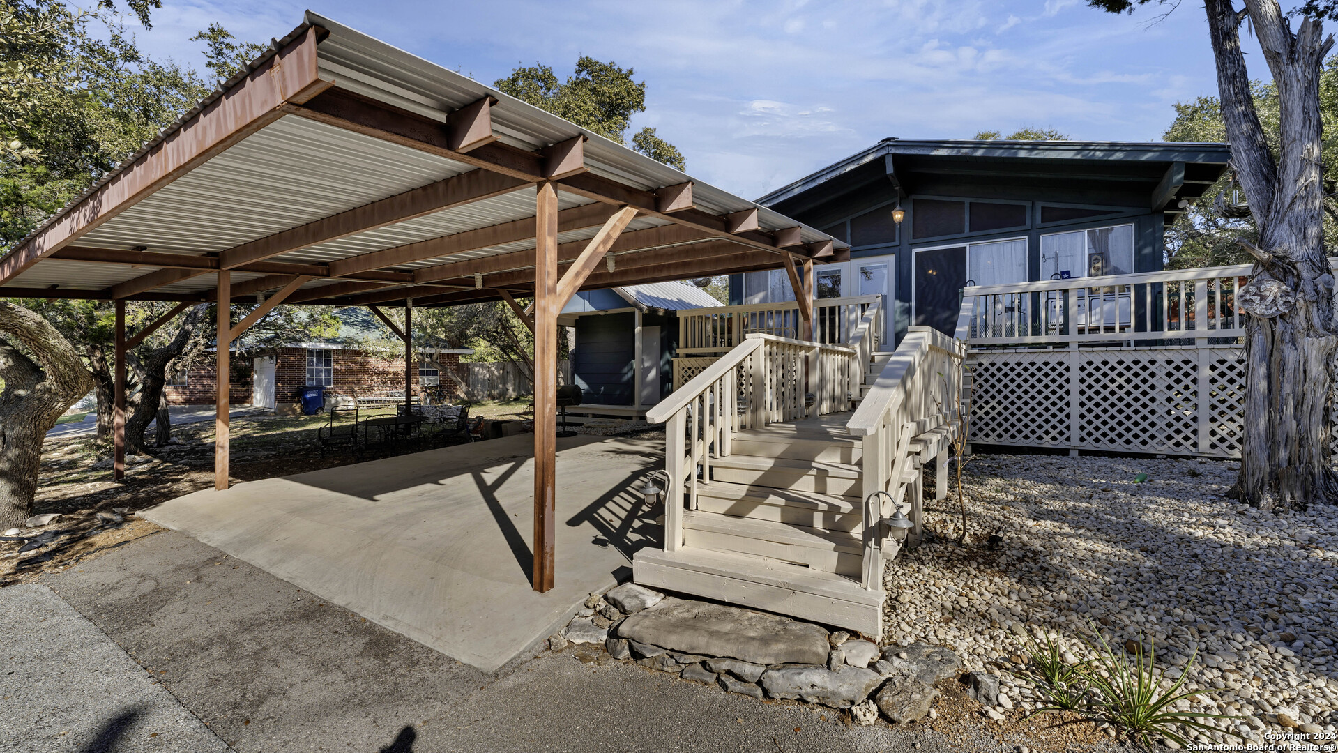 a view of a chairs and table in the patio