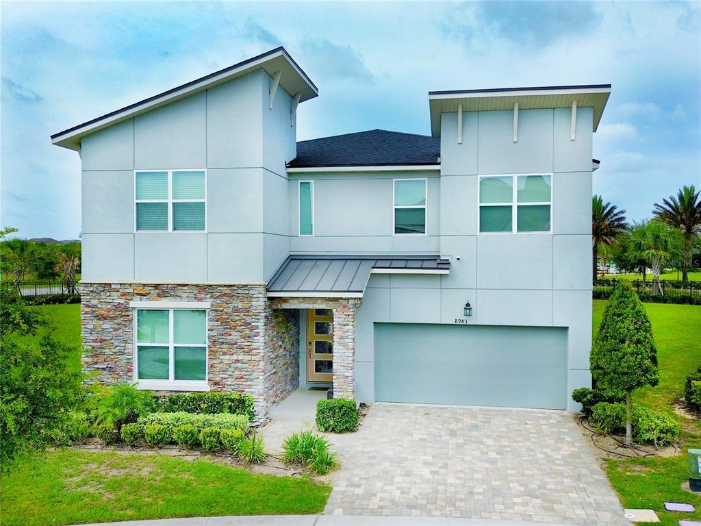 front view of a house with a yard