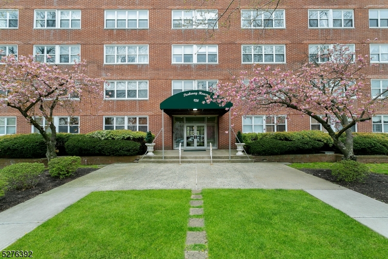 a view of a building with a yard