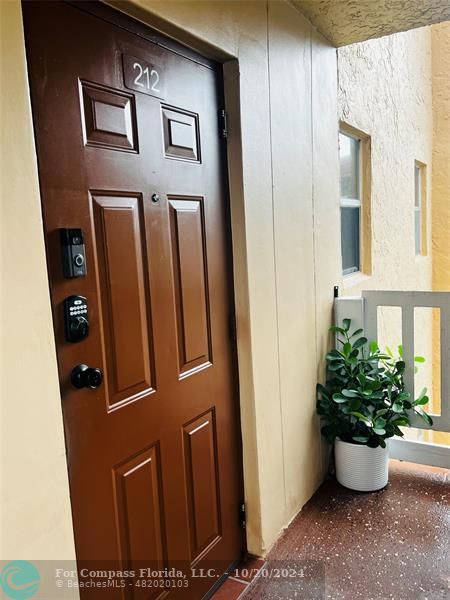 a view of a door and chair in the room