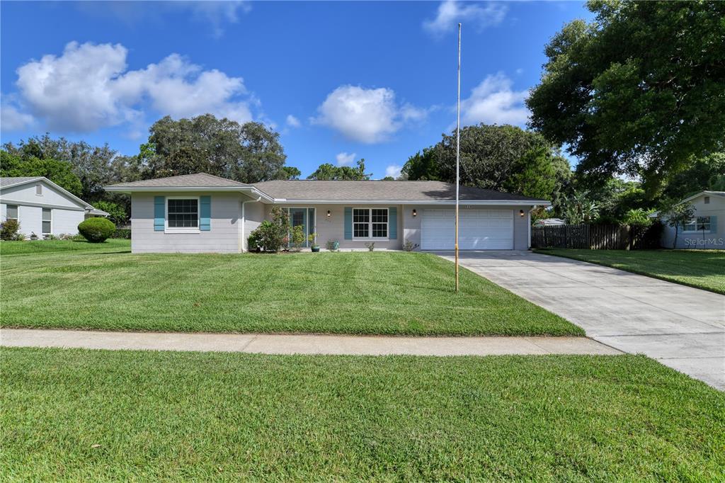 a view of a house with a yard