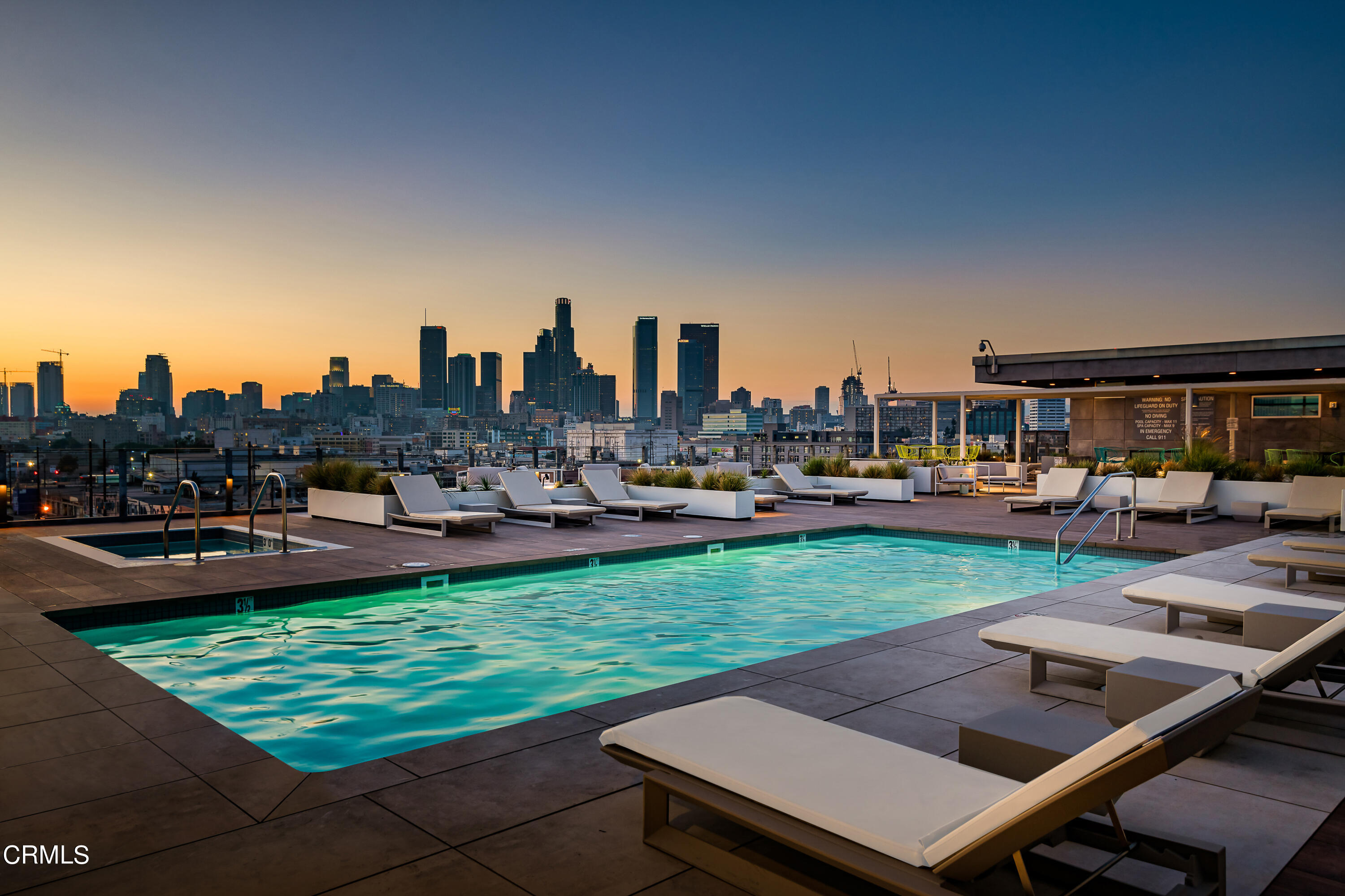 a view of a swimming pool and chairs in patio