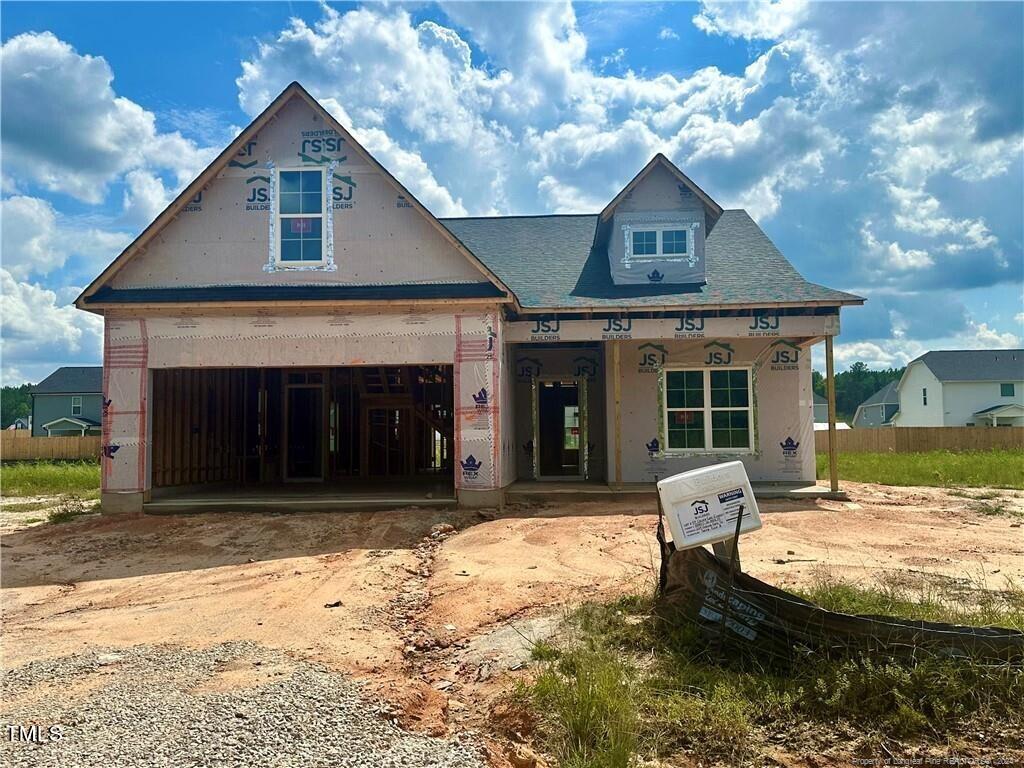 a view of a house with backyard porch and sitting area