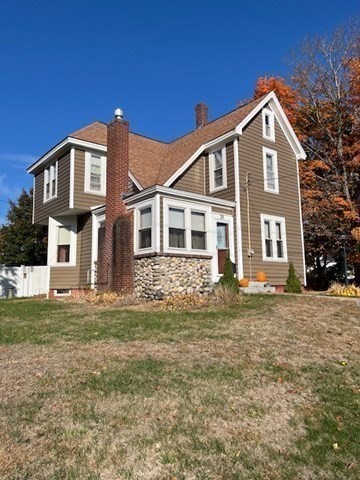 a front view of a house with a yard