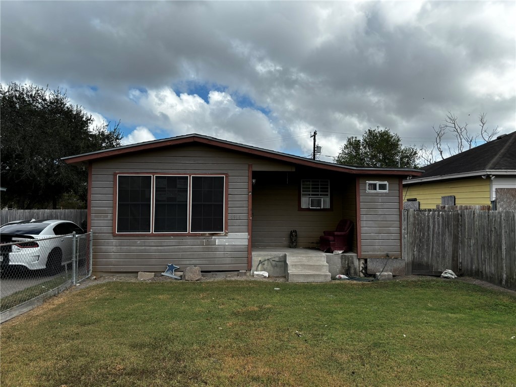 a front view of house with yard and seating area