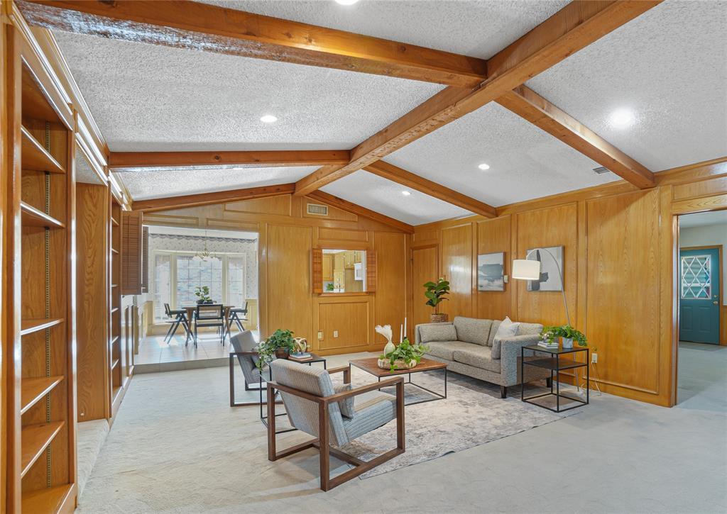 a living room with furniture and a table