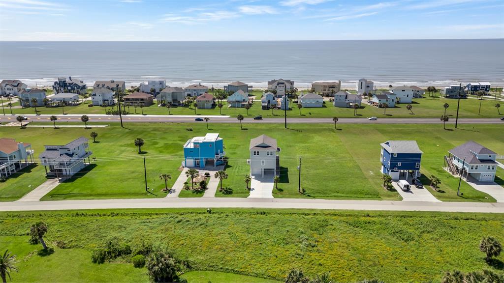 This 4-bedroom beach house offers views of the Gulf and the bay from the decks, situated on a spacious 1/2 acre lot. Imagine spending your time enjoying the Gulf of Mexico and relaxing.