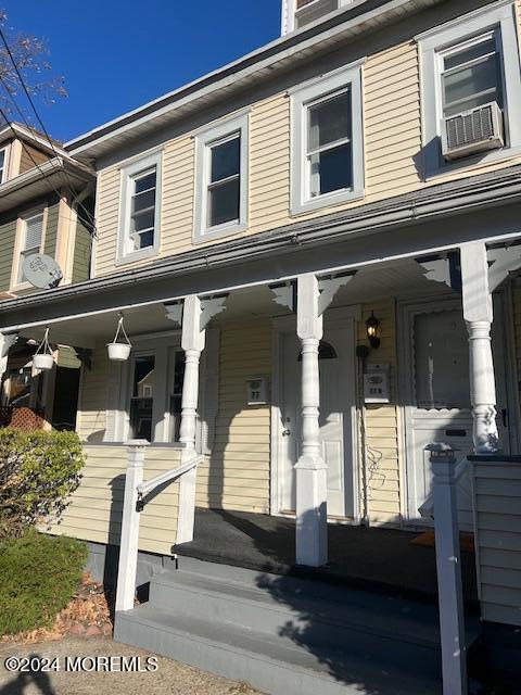 a front view of a house with a porch