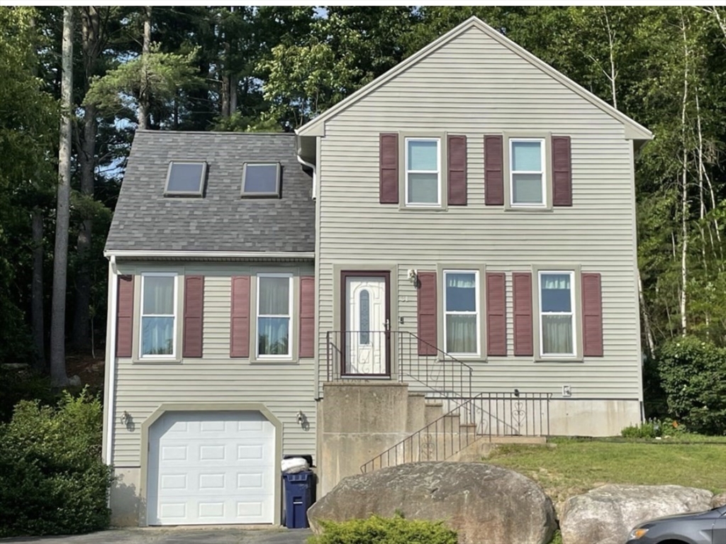 a view of a brick house with a yard