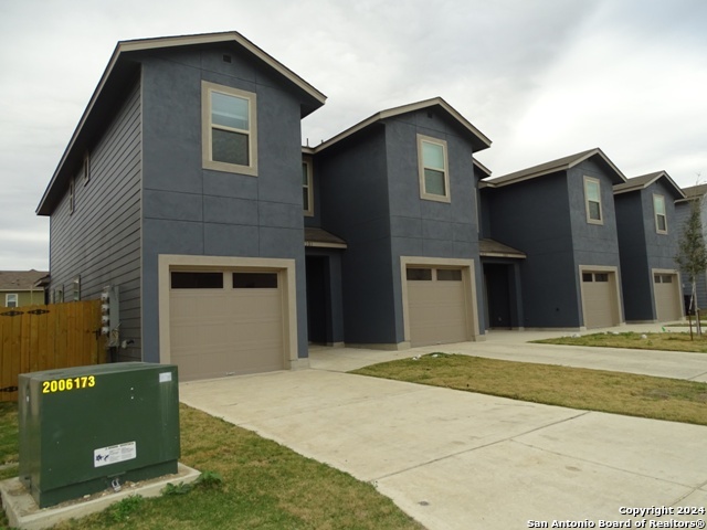 a front view of a house with a garage