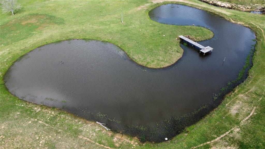 a view of a swimming pool with a yard