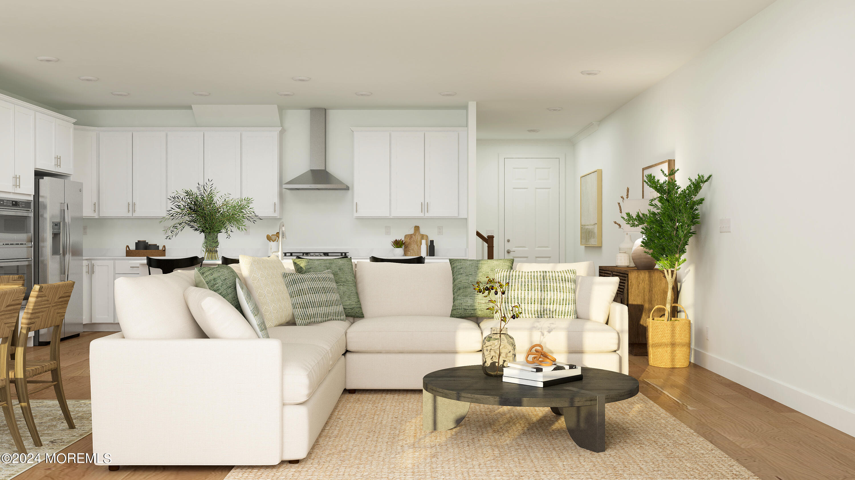 a living room with furniture and a potted plant