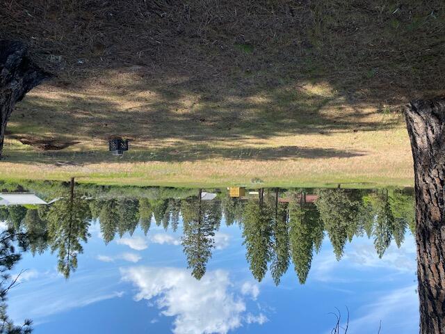 a view of a lake with a yard