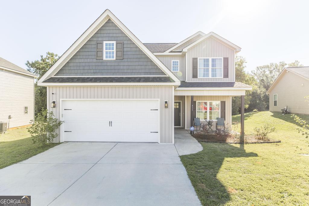 a view of a house with a yard