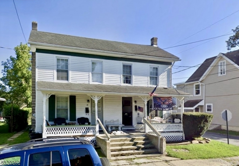 a front view of a house with a porch