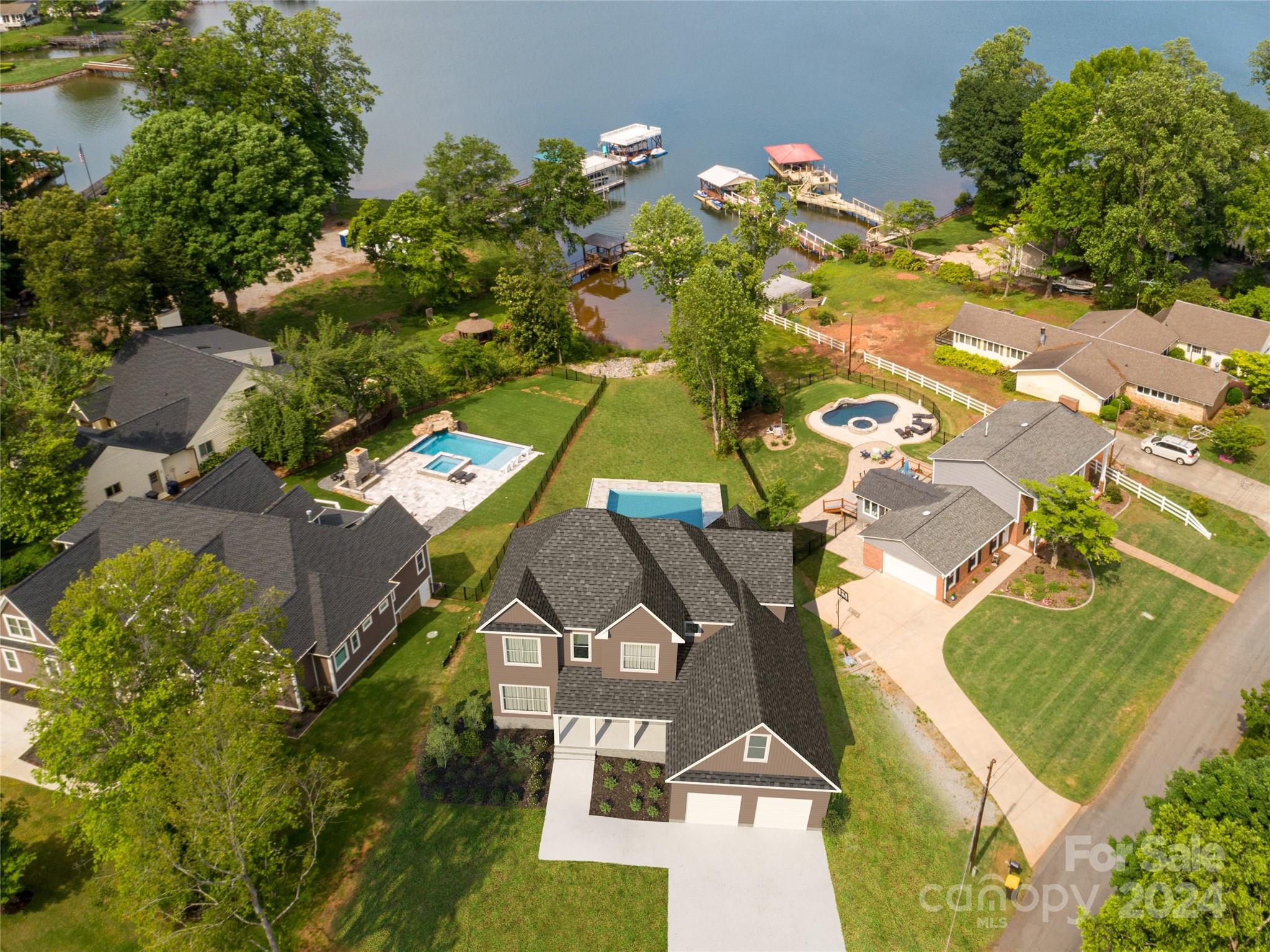 an aerial view of a house with a garden and swimming pool