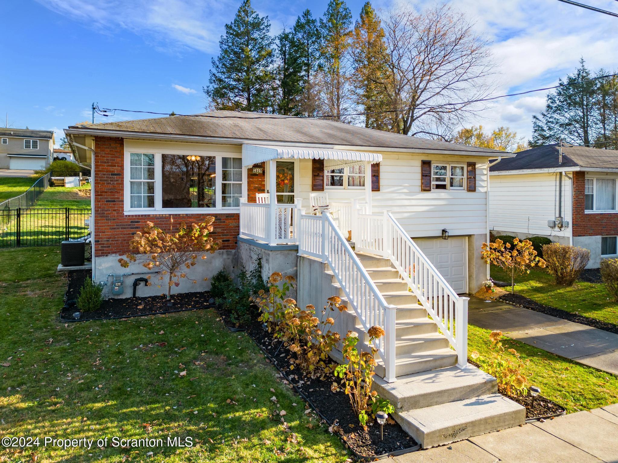 front view of a house with a yard