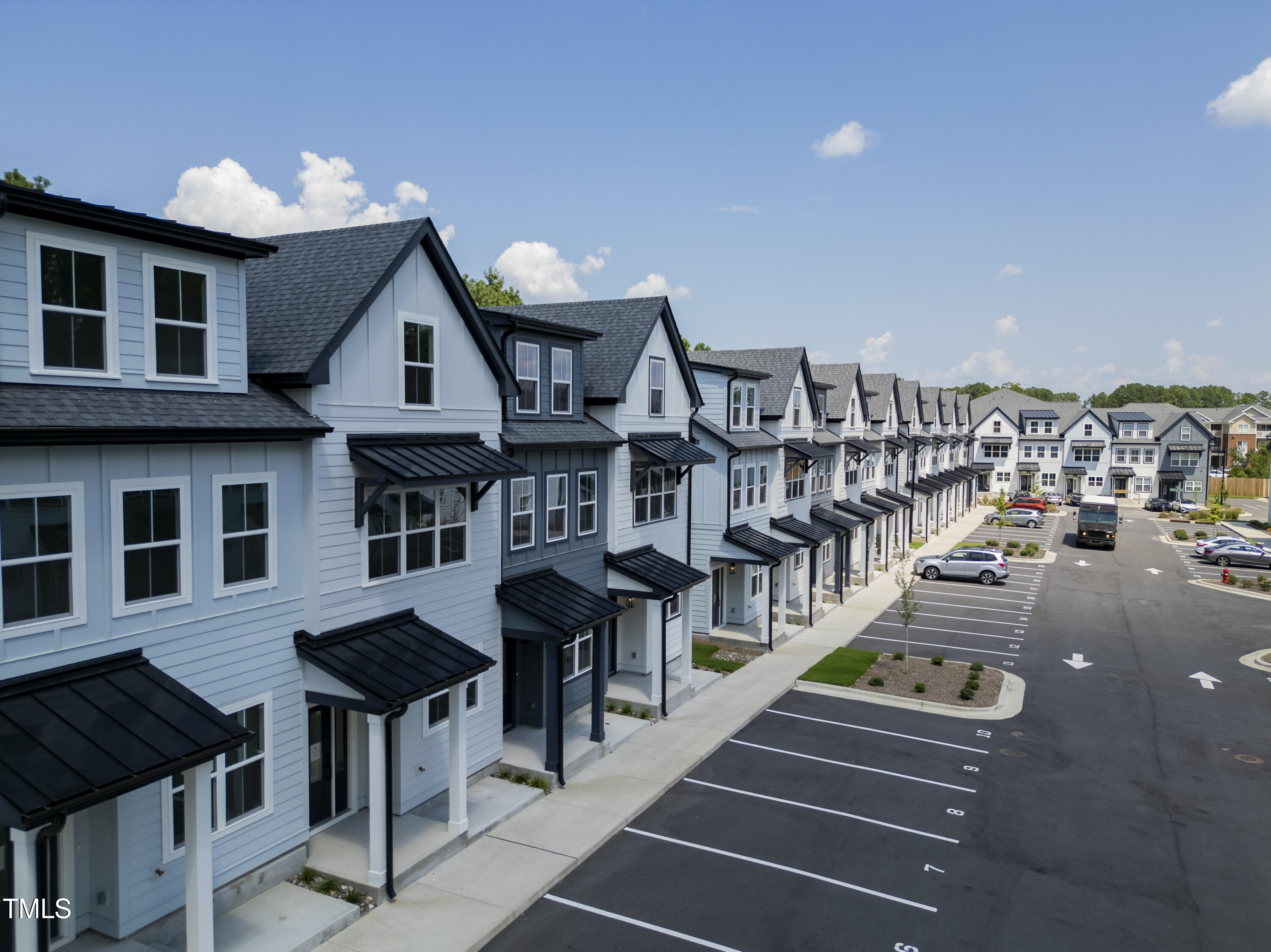 a view of multiple houses with a street