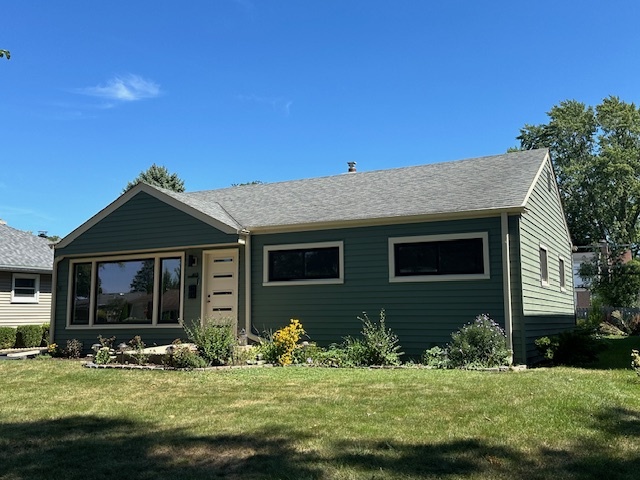 a view of a house with backyard porch and sitting area