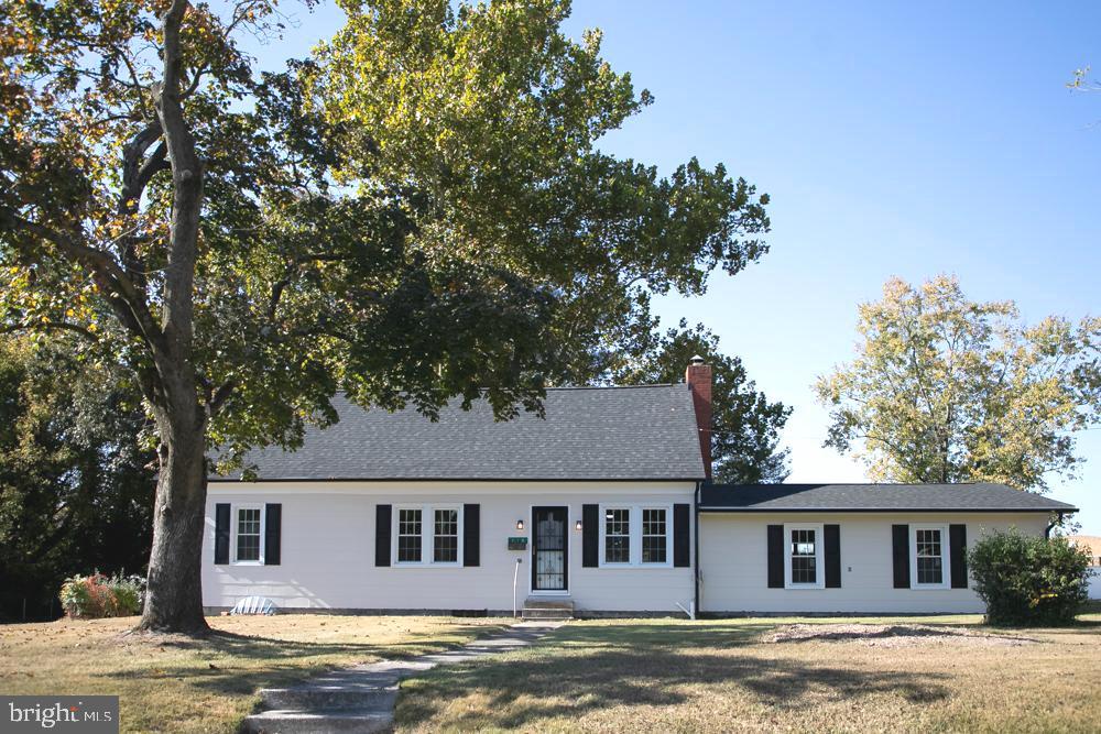 front view of a house with a big yard