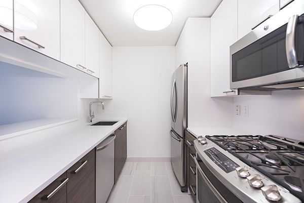 a kitchen with a stove and a microwave