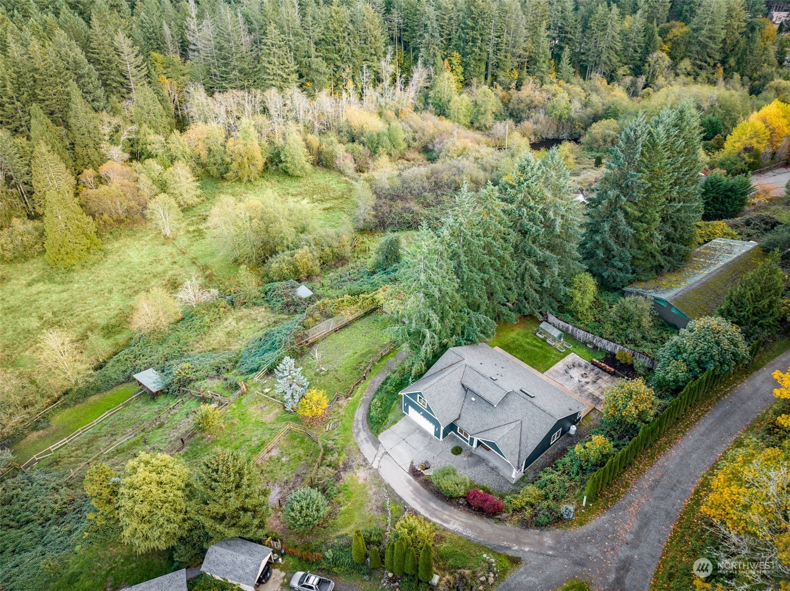 an aerial view of a house with a garden