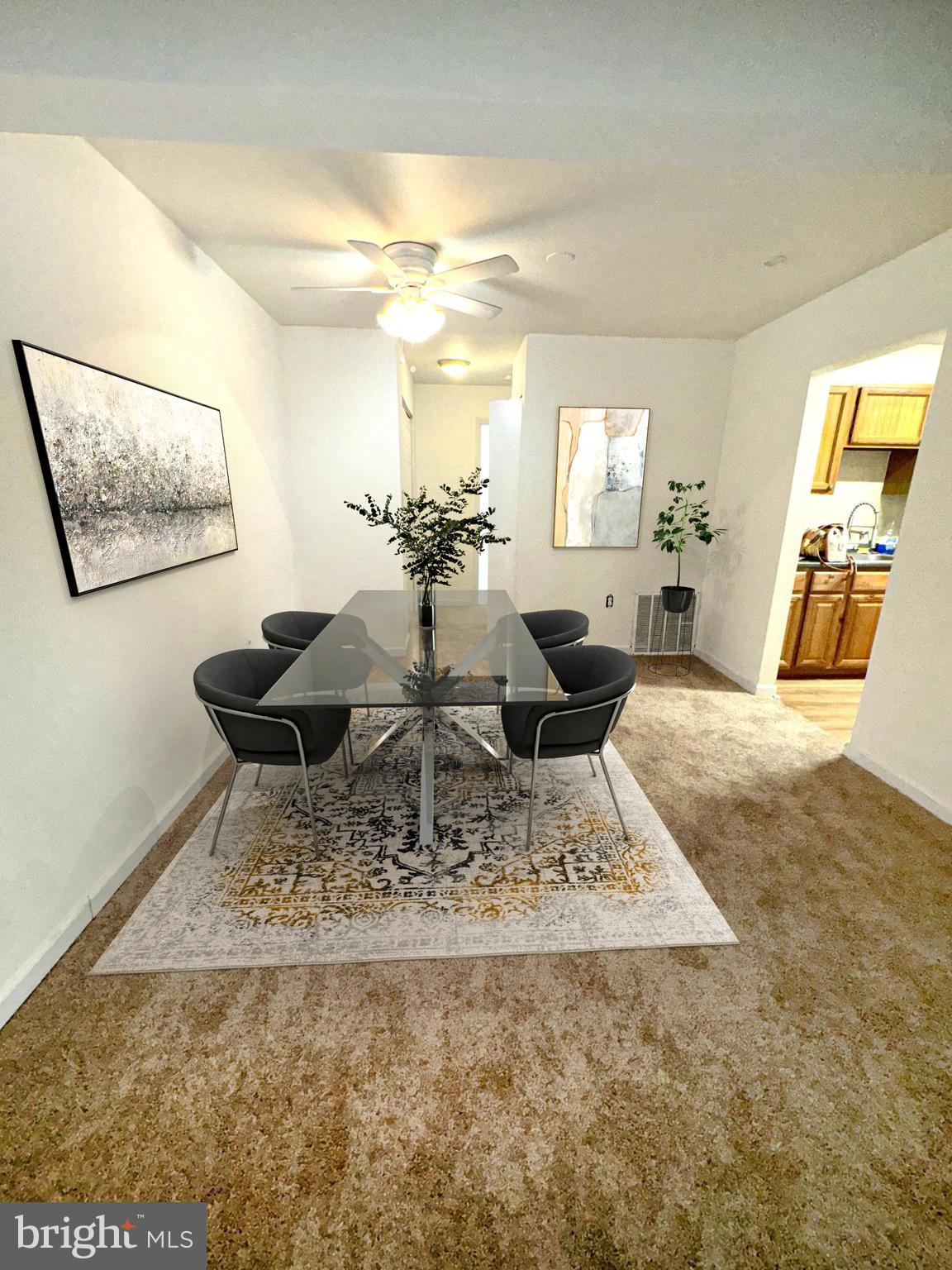 a view of a living room and dining room