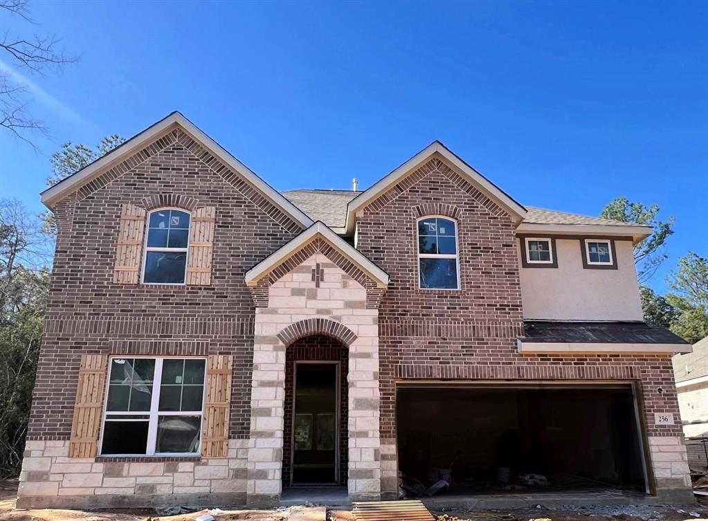 a front view of a house with a garage