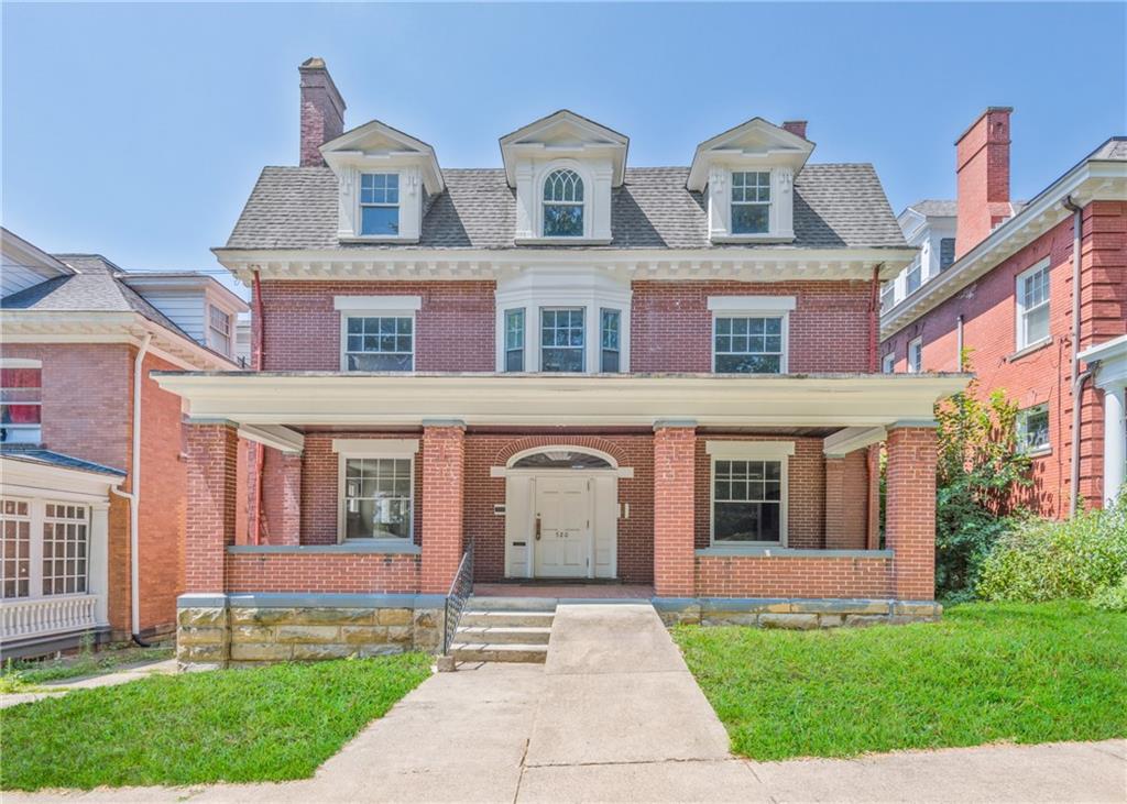 front view of a house with a yard