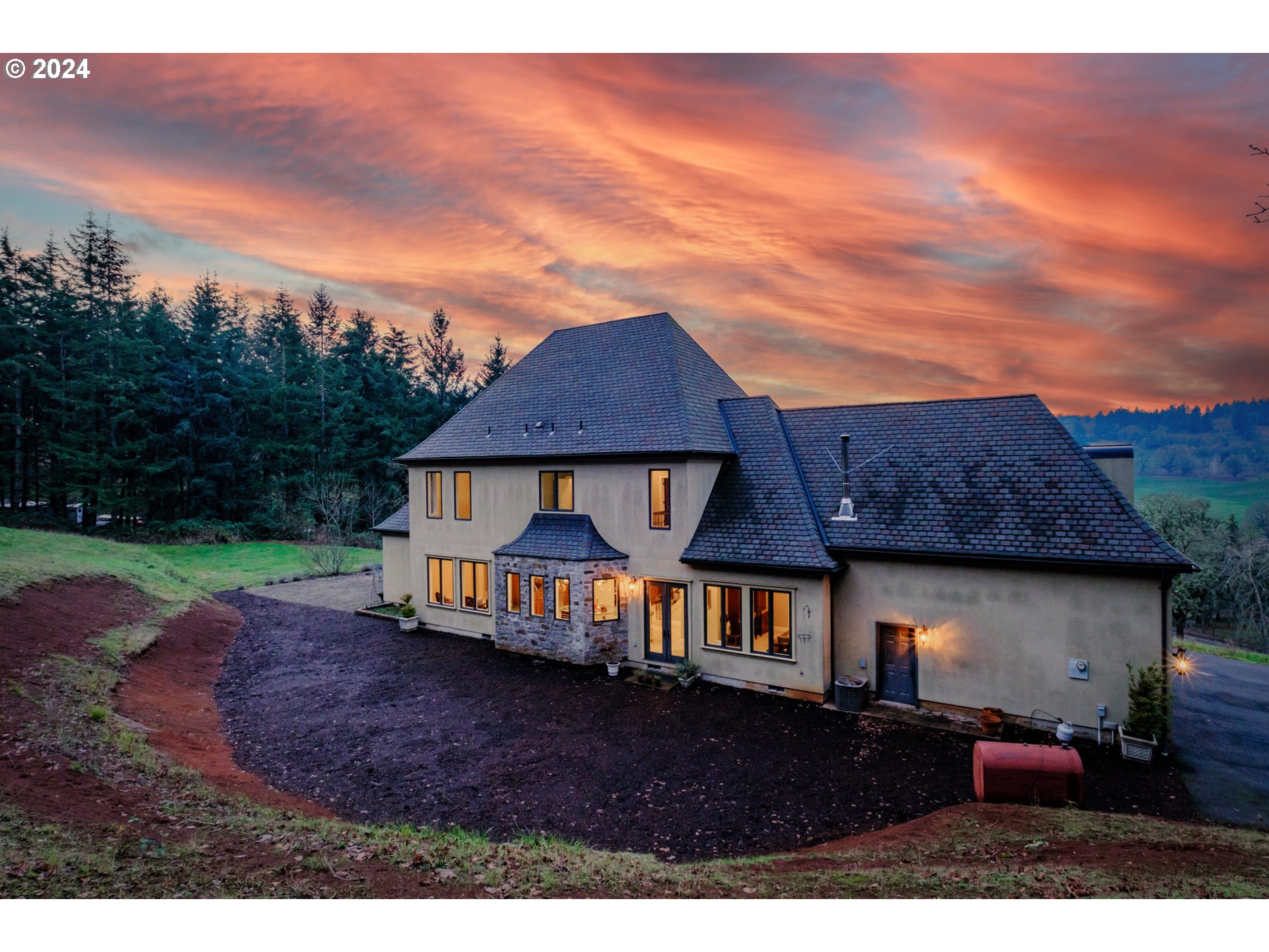 a front view of a house with garden