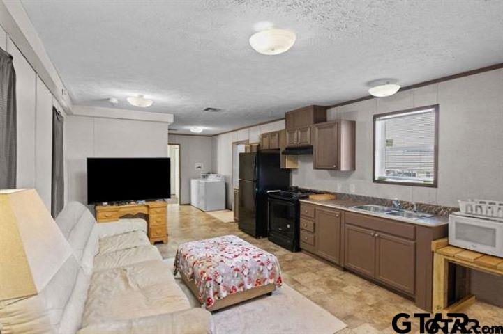 a bedroom with furniture and a flat screen tv