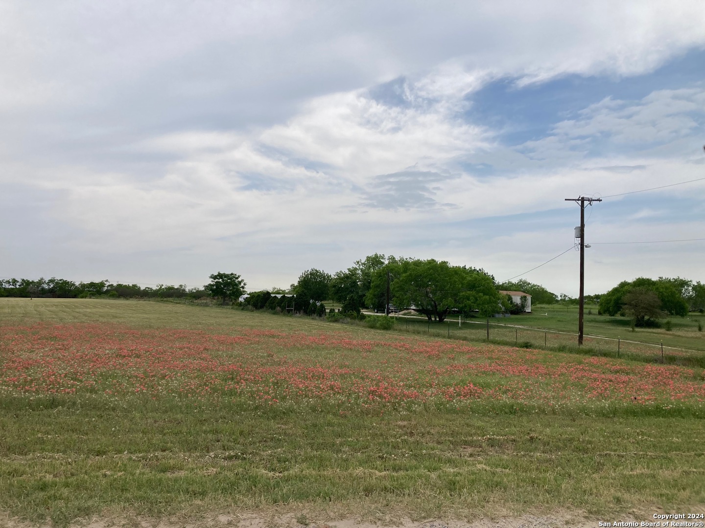 a view of a lake with a big yard