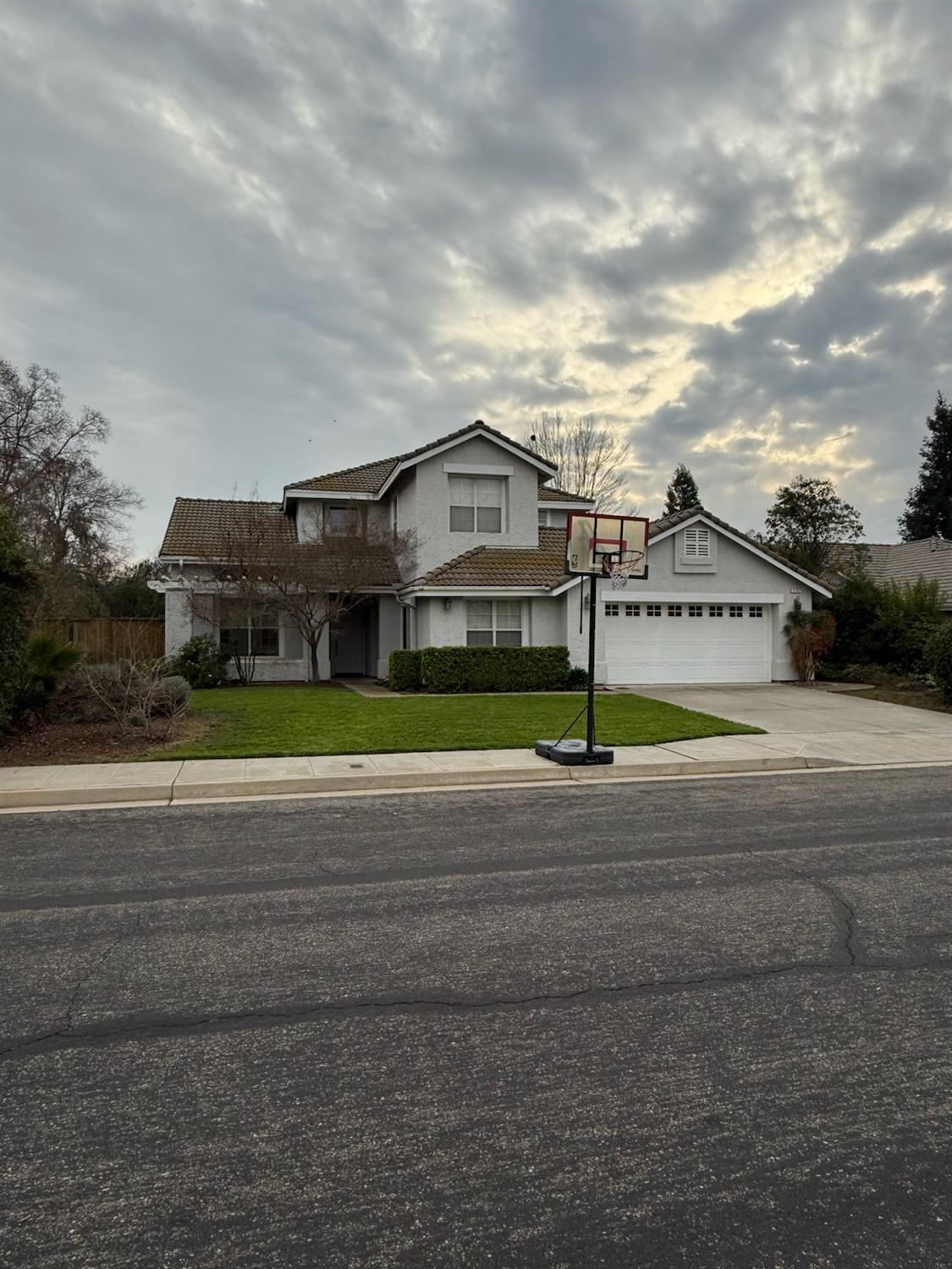 a view of a house next to a yard