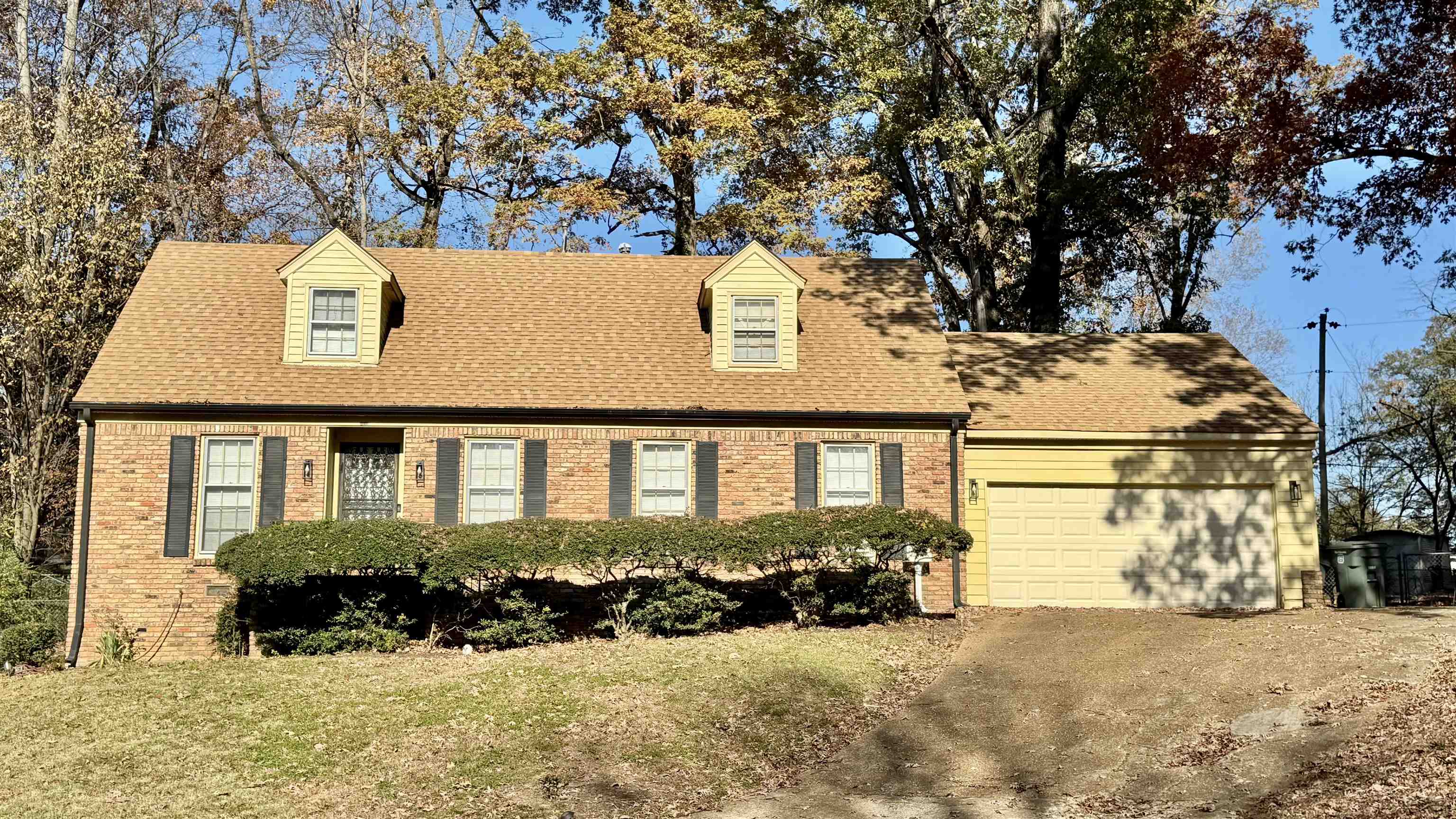 front view of a house with a yard