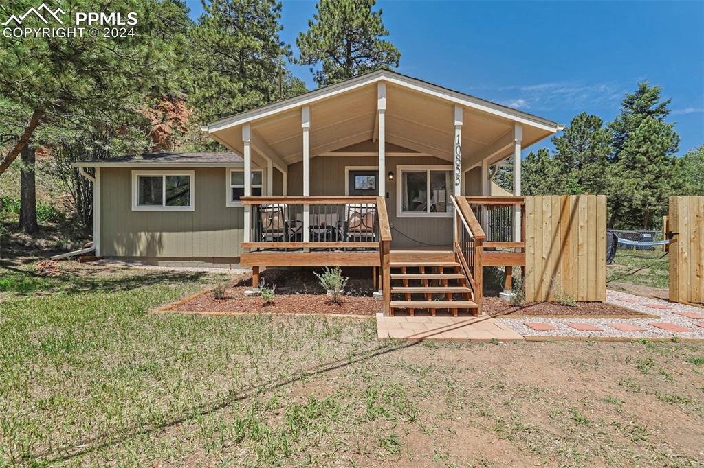 Front of house featuring a wooden deck