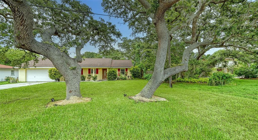 a view of a house with a backyard