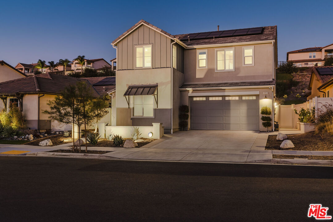 a front view of a house with yard