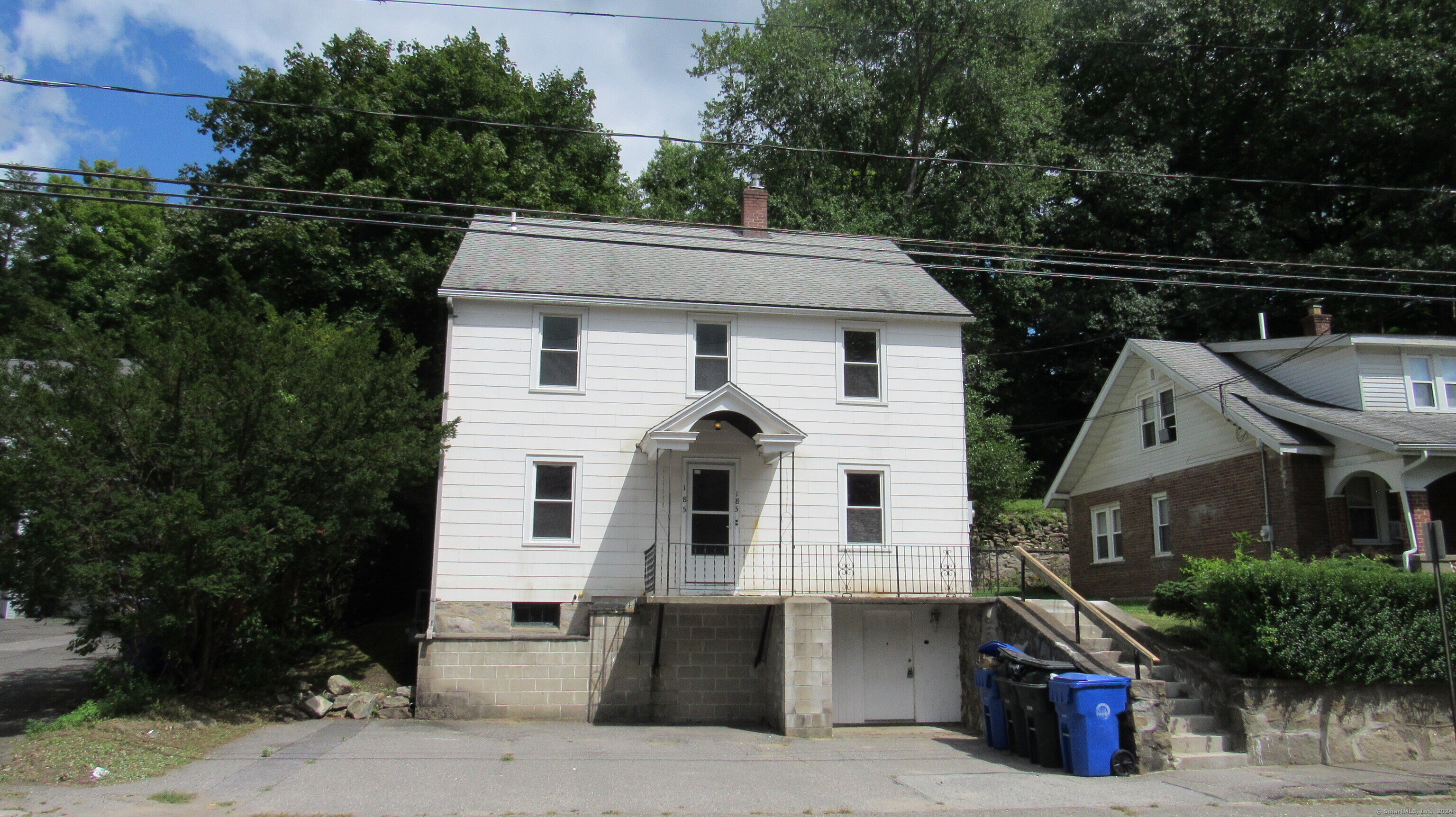 a front view of a house with garage