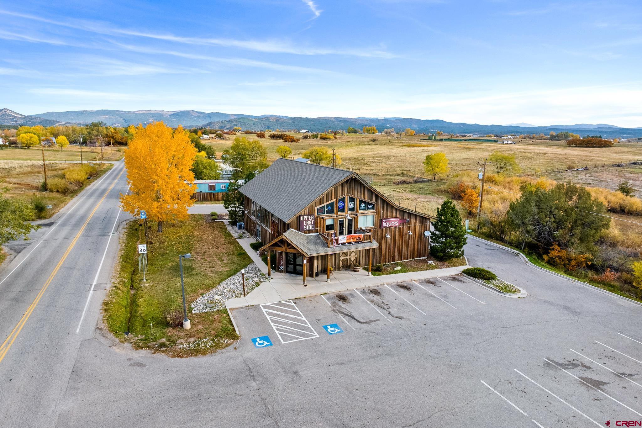 an aerial view of a house with outdoor space