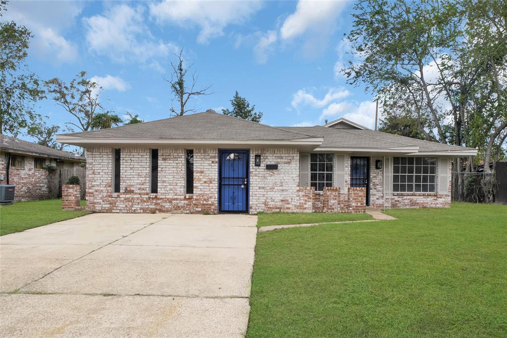 a front view of a house with a garden and patio