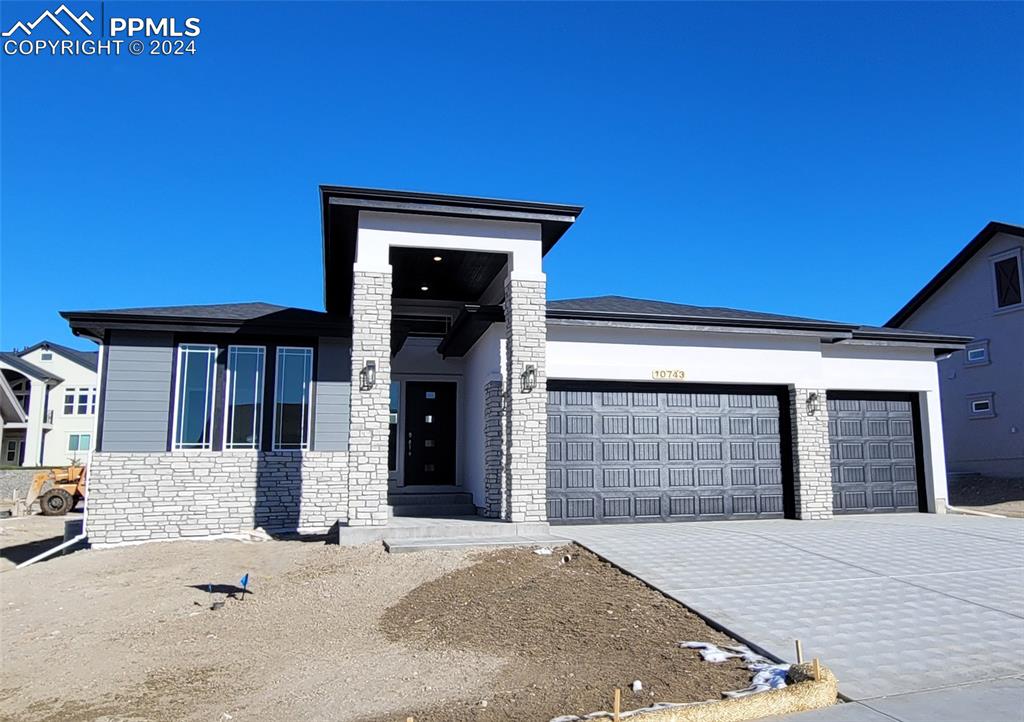 a front view of a house with a garage