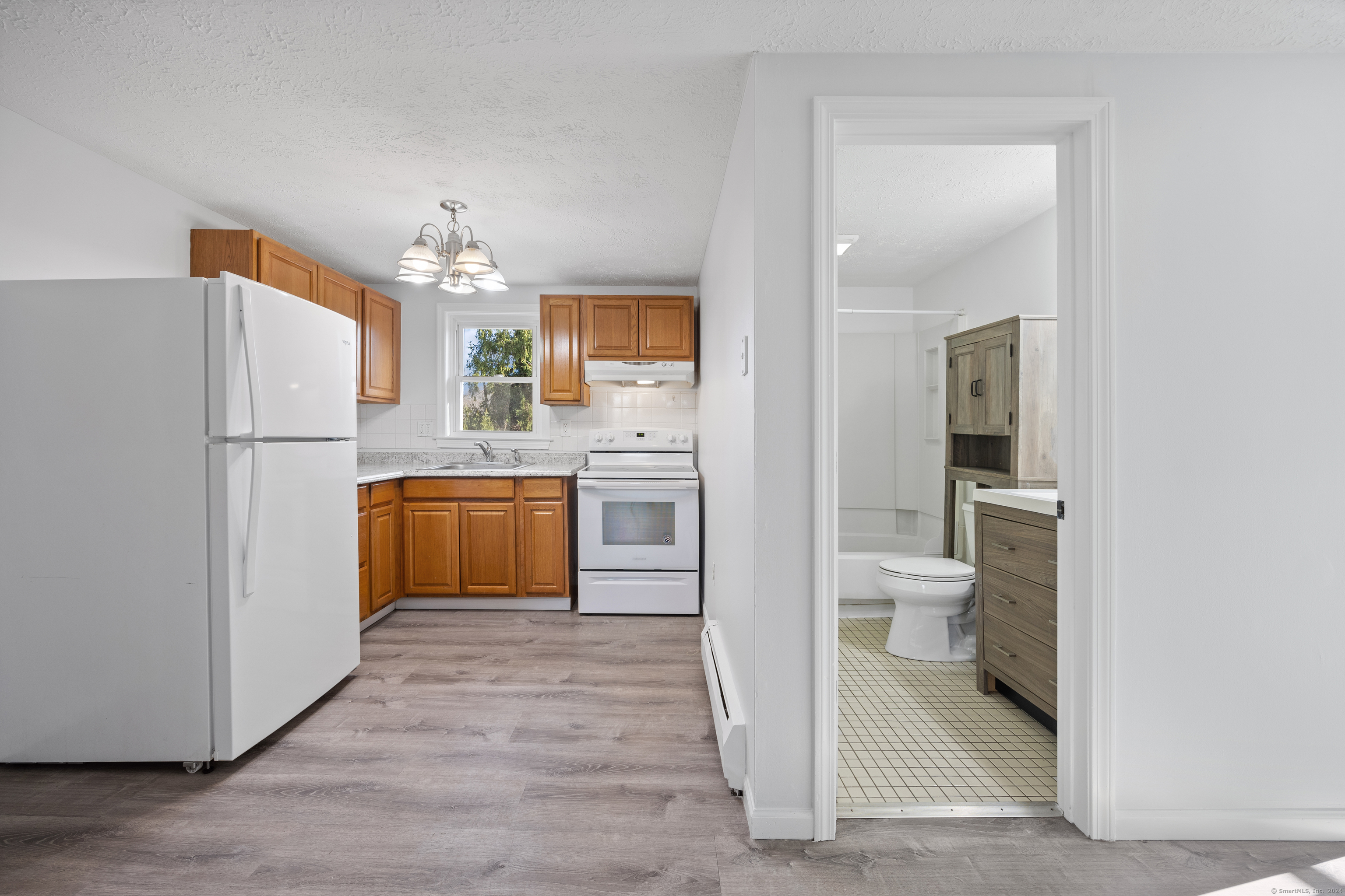 a kitchen with a refrigerator a sink and dishwasher