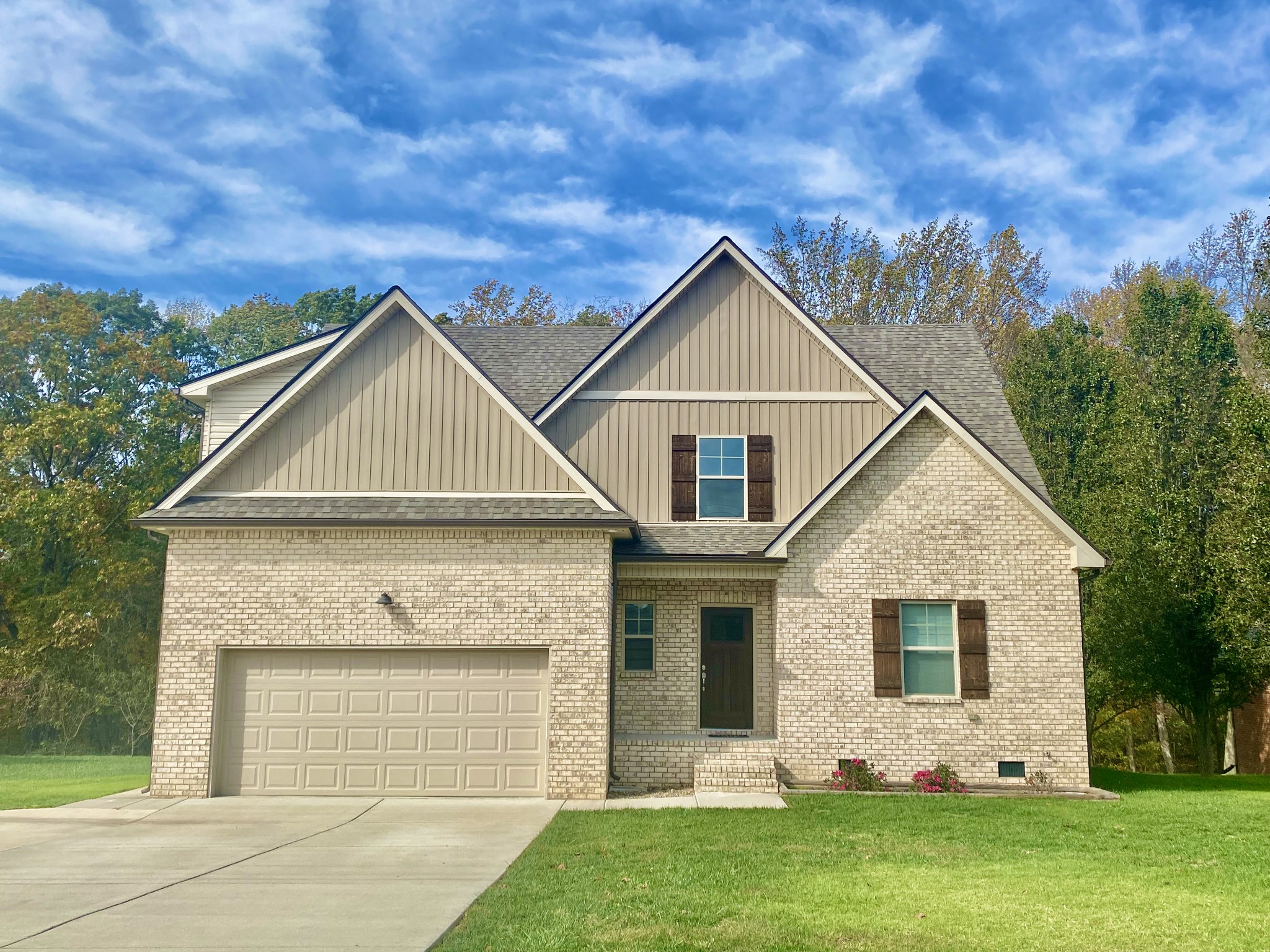 a front view of a house with a yard