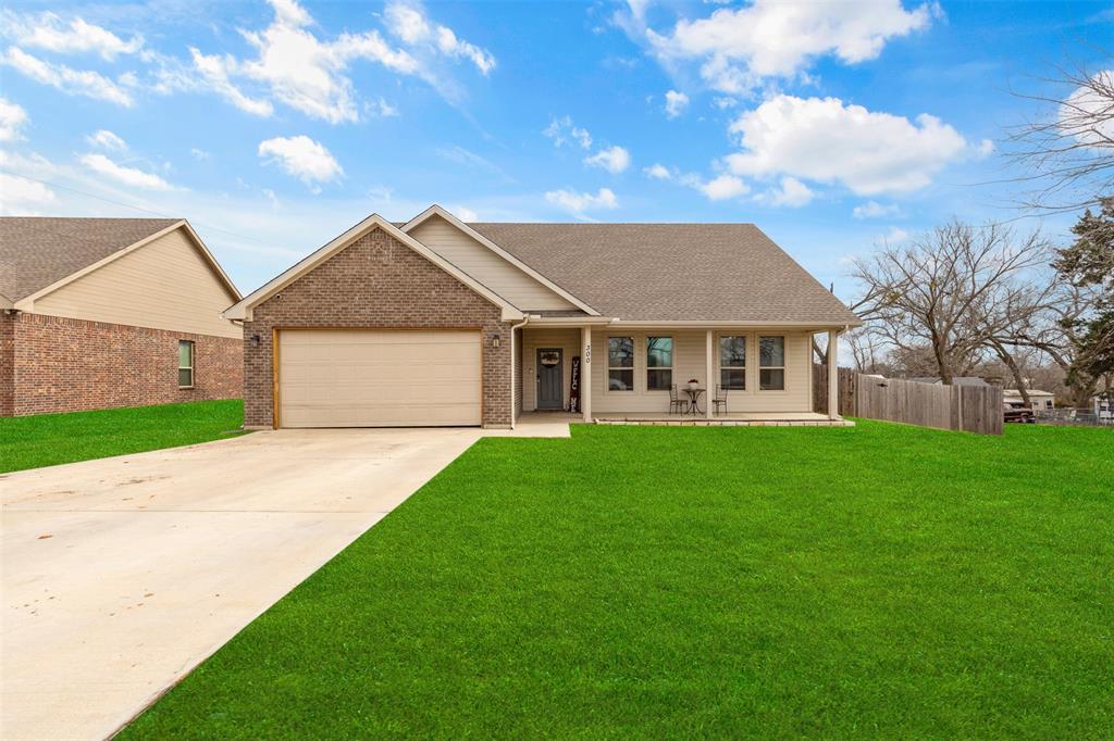 a view of an house with backyard space and garden