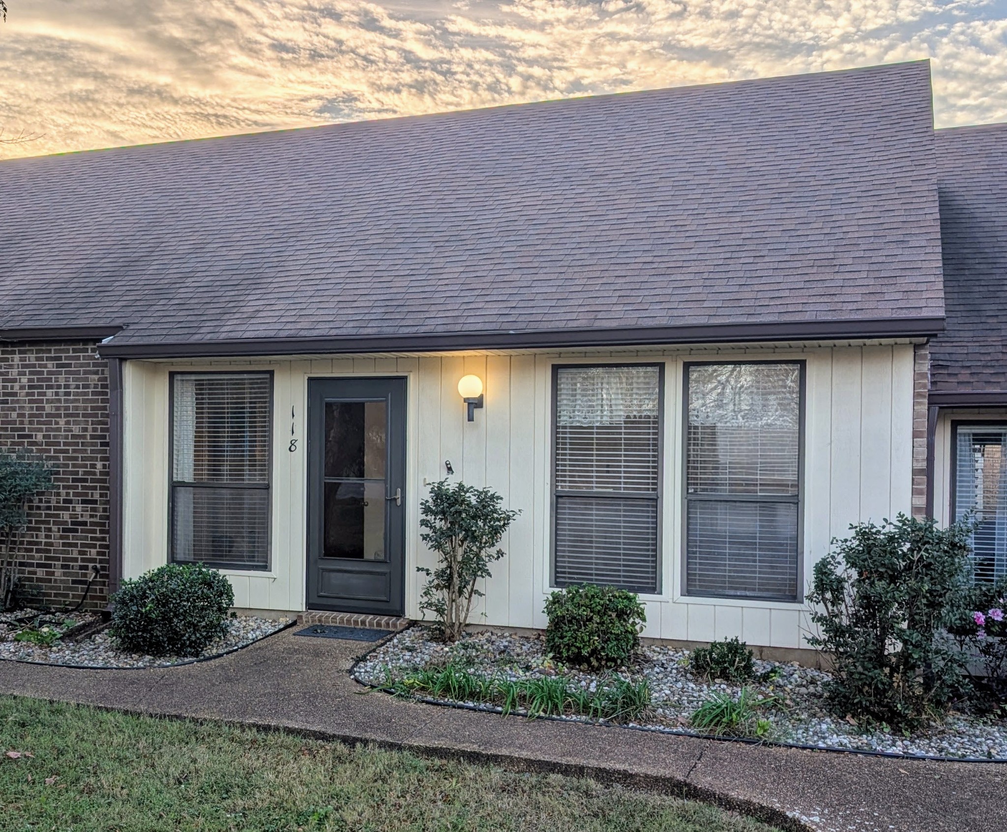 a front view of a house with garden