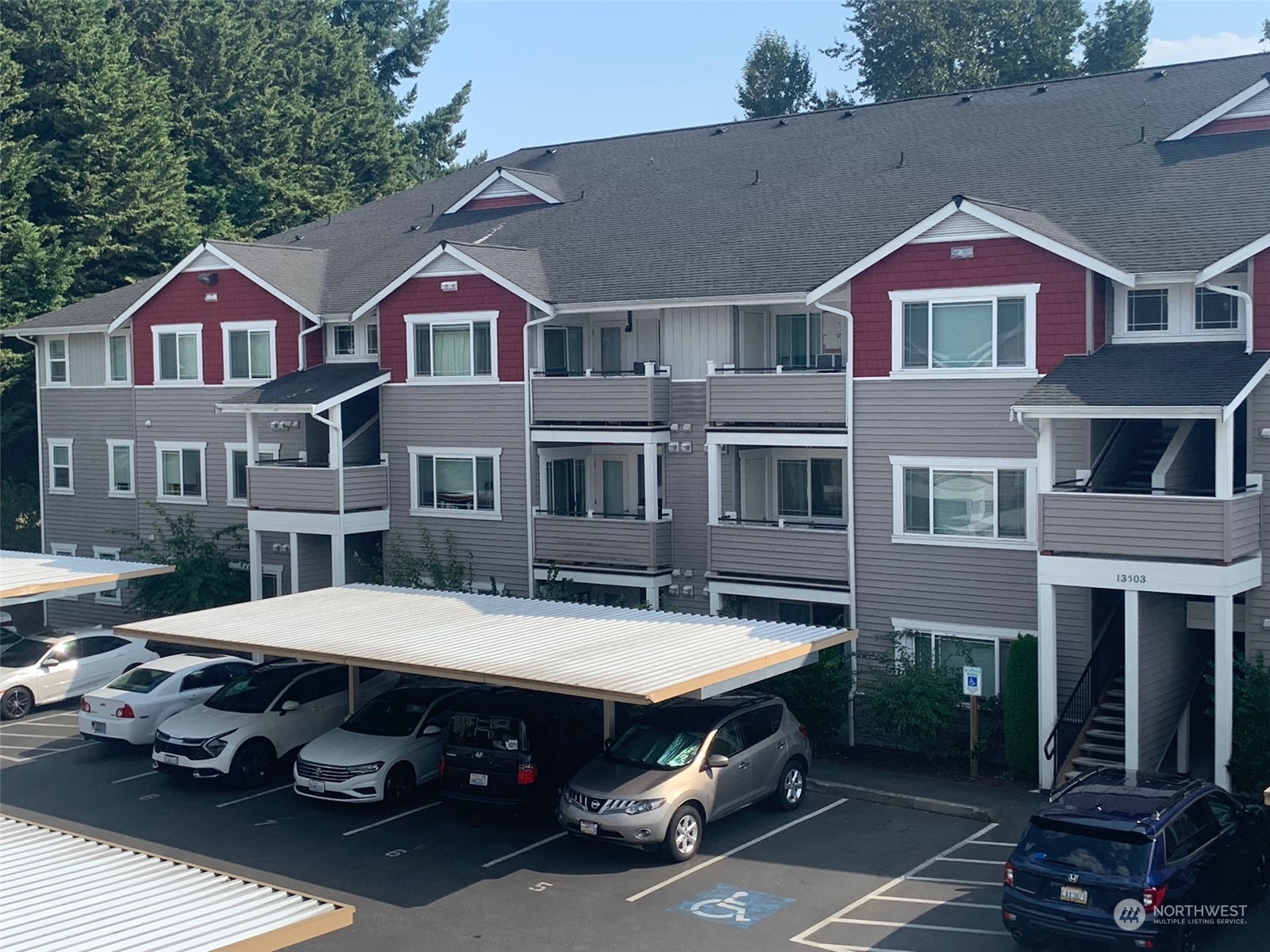 a front view of a building with parking space