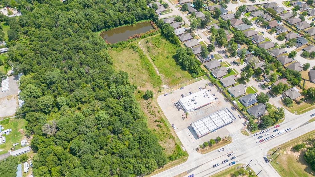 an aerial view of a residential apartment building with a yard